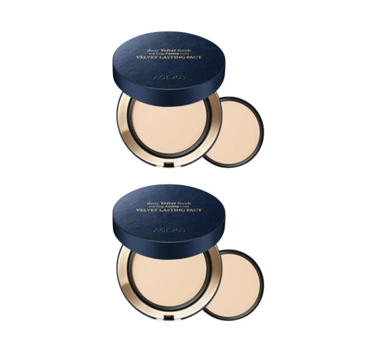 Two open compacts with a navy blue lid on a white background