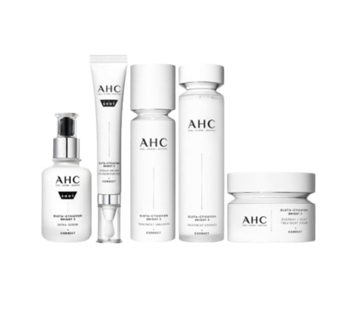 A set of five AHC skincare products, including a serum, eye cream, night treatment cream, treatment essence, and treatment emulsion, all in white packaging with minimalistic design.