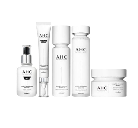 A set of five AHC skincare products, including a serum, eye cream, night treatment cream, treatment essence, and treatment emulsion, all in white packaging with minimalistic design.