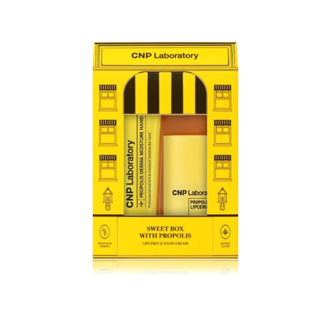 A product packaging for CNP Laboratory Propolis Lipcerin & Hand Due Set featuring a yellow and black design with images of a tube of hand cream and a tube of lip balm.