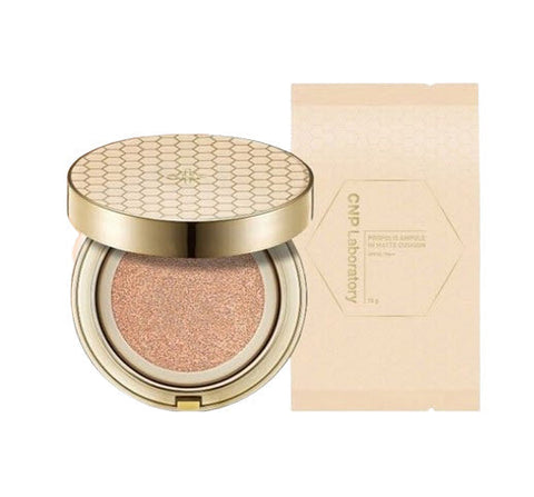 Cosmetic compact with gold lid and beige case on a white background