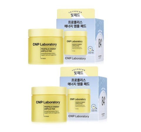Two jars of CNP Laboratory Propolis Energy Ampule Pad with their packaging boxes. One jar is yellow with a blue label, and the other is blue with a yellow label.