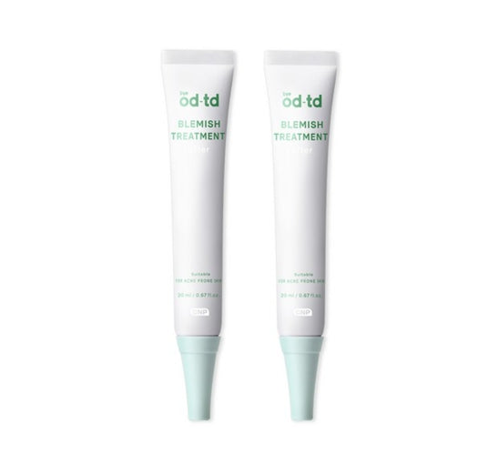 Two tubes of 'od td blemish treatment' on a white background