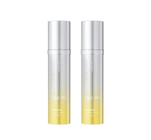Two silver and yellow skincare bottles on a white background