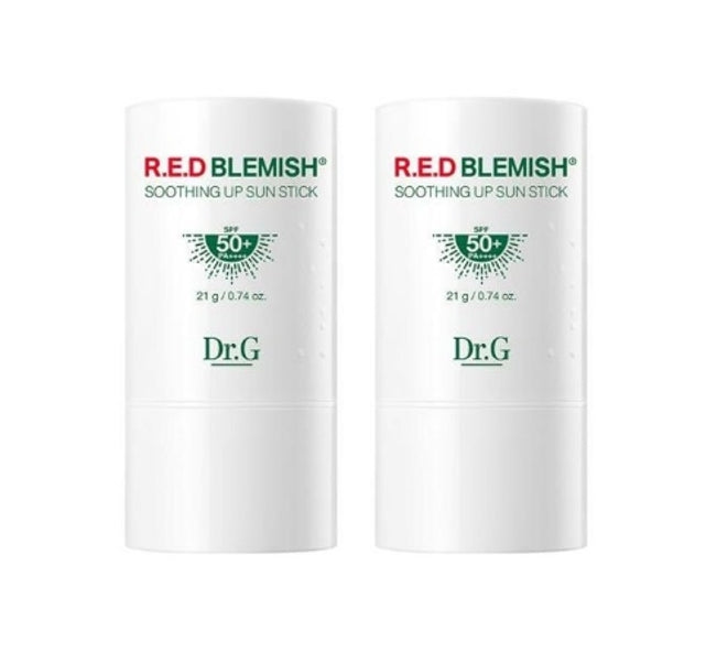 Two sticks of Dr. G Red Blemish Soothing Up Sun Stick, labeled with 'SPF 50+ PA++++' and '21g/21g' indications, in a white packaging with green and red accents.