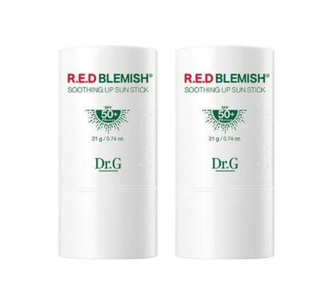 Two sticks of Dr. G Red Blemish Soothing Up Sun Stick, labeled with 'SPF 50+ PA++++' and '21g/21g' indications, in a white packaging with green and red accents.