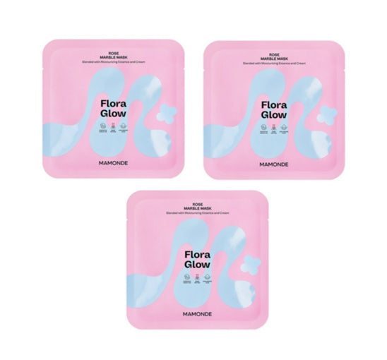 Three pink 'Flora Glow' face mask packages with blue designs on a white background.