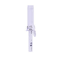 White hair straightener with black polka dots on a white background